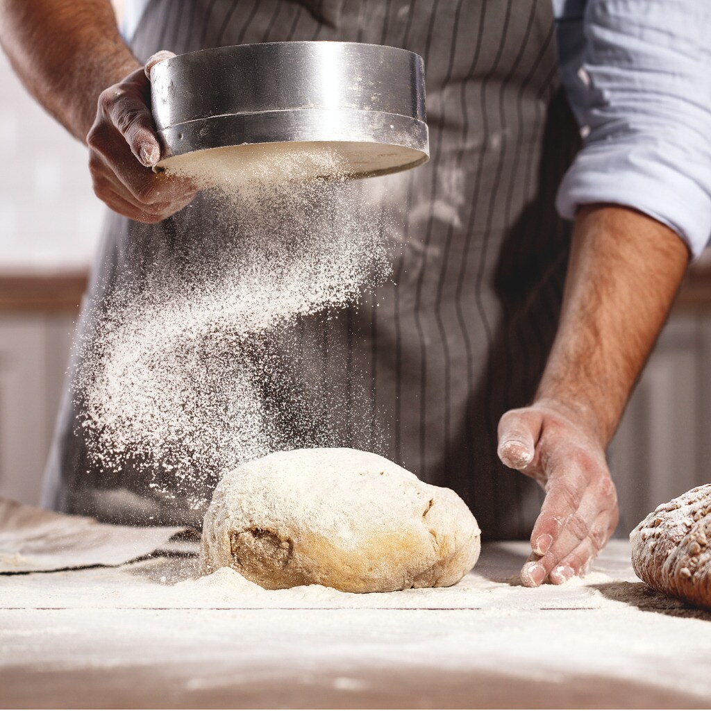 hands-of-bakers-male-knead-dough-picture-id941594062.jpg